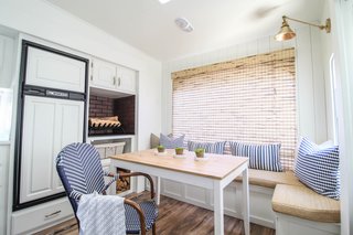 The bench seating with hidden storage turned this rear living area into Trina’s favorite part of the camper home. 