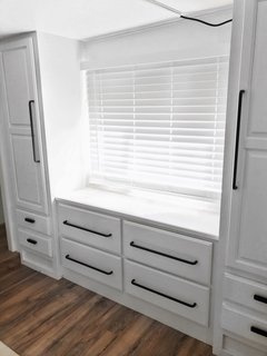 A Besta storage unit from IKEA works as both storage and seating.