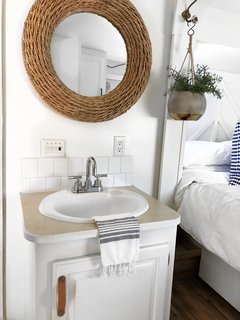 A sink and vanity in the bedroom makes use of a tight space.