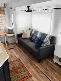 A Better Homes and Gardens Porter Fabric Tufted Futon from Walmart is a smart, small-space furniture option.