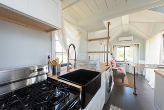 The tiny house comes with a fully equipped kitchen.