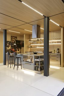 Arthur Casas Design included a freestanding kitchen and cabinetry for the interiors, so if needed, the modules can be easily disassembled and relocated to a new site. 