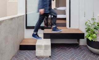 The terrace is just one-room-wide at the front with a compact courtyard at the rear.