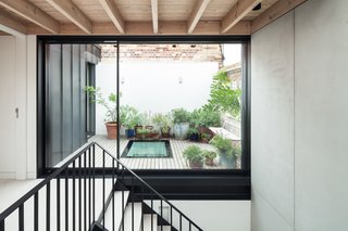 Scott has incorporated a bespoke timber and steel staircase next to the terrace to create a sunny core. 