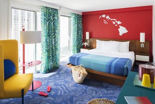 A warm and cheerful "Aloha" comes through in the tropical leaf motifs of the carpet and curtains.