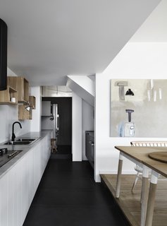 A fridge, laundry area, and office desk are incorporated into the butler’s pantry.