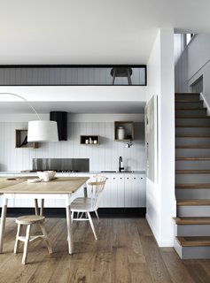 The kitchen and dining area are located on the lower level.