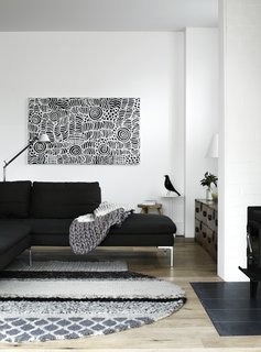 The ground floor consists of a large living room, dining area, and kitchen.