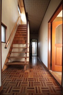 Before: the entrance foyer and stairs.
