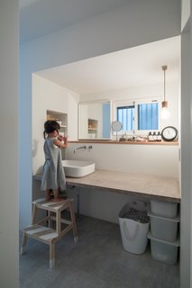 To lighten and brighten the formerly dark and claustrophobic interiors, soft monotones are expressed through the solid oak floors, and wallpapered walls and ceilings.