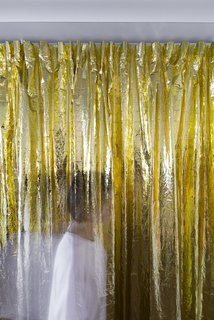 The playful curtain hides the kitchen worktops and appliances, so the corridor is clutter-free. This space works well as a waiting lounge for clients. 