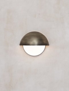 Initially, the couple began working with brass and blackened brass, but then started to obsess about finishes that looked and felt as if they had lived beyond their studio. 