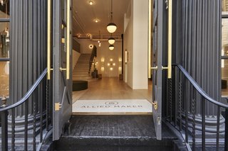The entrance to Allied Maker's new showroom in Tribeca, New York puts their meticulously crafted lights on immediate display.