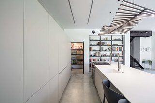 "The box was softened with a thin frame of floating concrete floor, along with a very thin roof rack on top, and joined together by diagonal side walls," explains Tal Goldsmith Fish, the firm's founder.