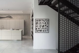 Carefully selected furniture items—by brands such as Desalto, Living Divani, and Ligne Roset—work together to complement the paired-back, elegant design of the residence.