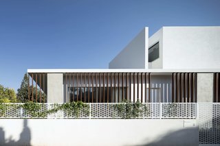 For this project, the architects have created a house that looks like a pavilion, in which several floors have neatly been hidden within the simple concrete "box" volume. 