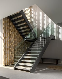 A staircase leads up to the private areas.