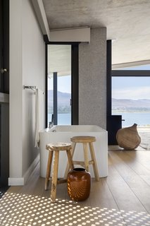 A bathroom that looks out to the lagoon.