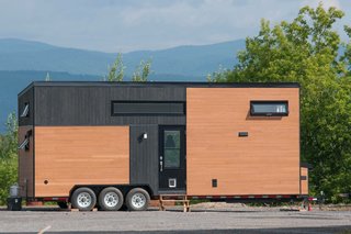 This 285-square-foot model has a kitchen that is located to the opposite of the bathroom, as well as plenty of storage areas. 