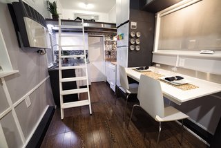 The house has 11-foot high ceilings, and the top of the walls can be used for storage. 