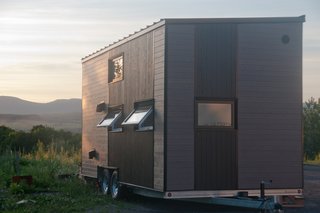 Though it’s just 190 square feet, this tiny house, which has plenty of wooden details and modern-rustic charm, is a home and office for its owner. 