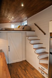 The complex design includes a room under the loft that has an ensuite bathroom.