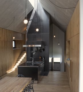 The kitchen has been designed to be the heart of the centrally aligned floor plan, and is equipped with a multifunctional wood stove.