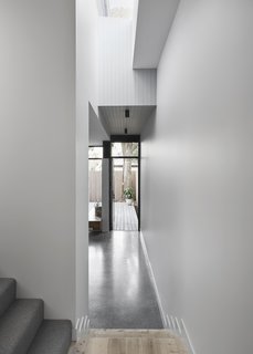 "One of the most interesting features is the glazed floor above the master corridor that allows a flood of light to penetrate into the kitchen zone," says Robertson.