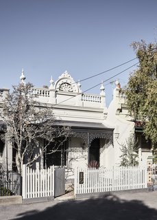 Despite the rear facade's contemporary design, the heritage details on the front of the house were retained and restored.
