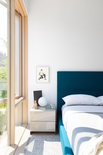 The home is styled with Bensen furniture in exclusive Raf Simons fabrics, as well as Cloth Studio linens, curtains, and bedding. 
