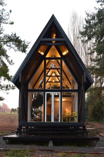 On the first floor of Casa R is a woodshed and a "chiflonera." This area between the interiors and exteriors is commonly found in Chilean/Patagonian homes, as it helps to regulate the region’s extreme temperature changes. 