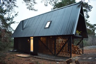 "The cabin is elevated from the ground, and has slopes on the terraces and two floors. The slopes blends with the natural terrain and help reduce costs in foundations. The roof also has a steep slope to protect it from snowfall in the winter," explains Lagos.