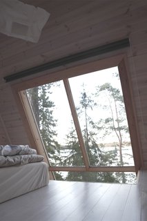 Sticking with the essentials and eliminating all unnecessary elements, Falck created a floor plan that includes a lower level and a sleeping loft. The loft has just enough room for a bed and storage for his clothes.