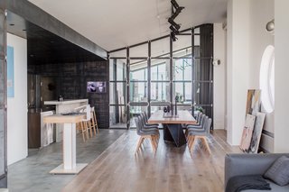 A DJ stand, located between the living room and dining area, comes in handy for parties. 