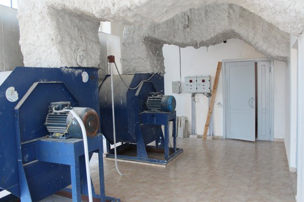 Before: a peek at the heavy machinery that was once stored in the space.