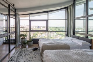 A guest bedroom is located at the other end of the living room.