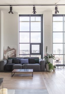 The living and dining areas have been relocated closer to the fully glazed exterior walls, where they can now enjoy more light.