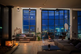 The apartment has been carefully configured to take full advantage of the 180-degree views of the city skyline.