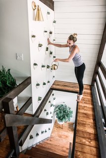 A succulent wall adds texture and greenery to the home.