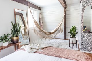 A hammock swings in one of the bedrooms.