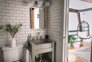 A guest bathroom is located near the top of the stairs.