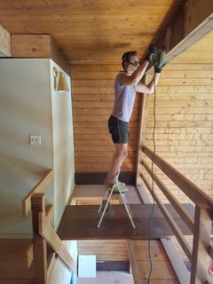 Ely took four months to sand and refinish every beam in the house.