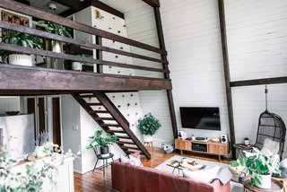 After: The fresh, white interiors help the home feel more spacious and offset the exposed wood beams.