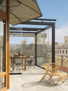 An armchair by Teodora Exteriorismo on the roof deck.