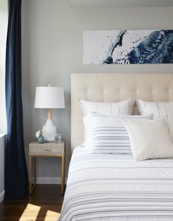 The master bedroom after the renovation. "Our solution was to move the entire master suite up to the top floor, which had previously been occupied by two guest rooms and a play space. This gave the couple’s suite more privacy, as well as access to the roof deck, which presents amazing views of Manhattan," explains Tang.