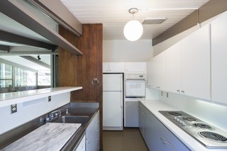A streamlined, white kitchen.
