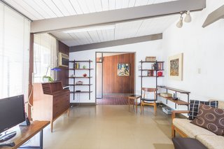 The integrity of the house’s midcentury spirit are expressed in its tongue-and-groove construction, clerestory windows, exposed posts and beams, and vaulted ceilings. Concrete block, redwood siding, Douglas fir plywood fit-outs create a warm and textured material contrast.