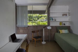 One of the three bedrooms has a single bed and a study desk.