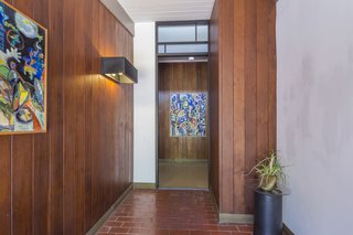 The house is in excellent condition and retains much of its original midcentury form and materials.