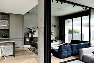 The living room opens out to an alfresco area with a pool.